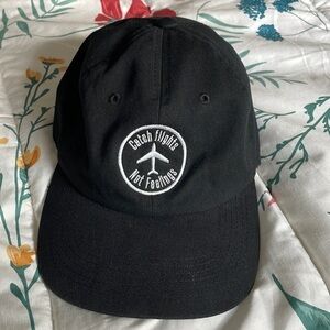 CATCH FLIGHTS NOT FEELINGS hat with adjustable strap one size